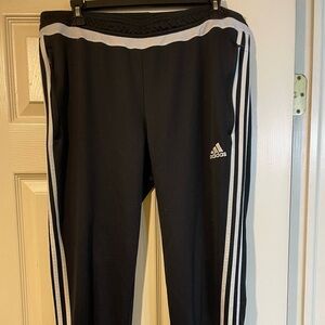 Adidas ladies Black Joggers with White Stripes.